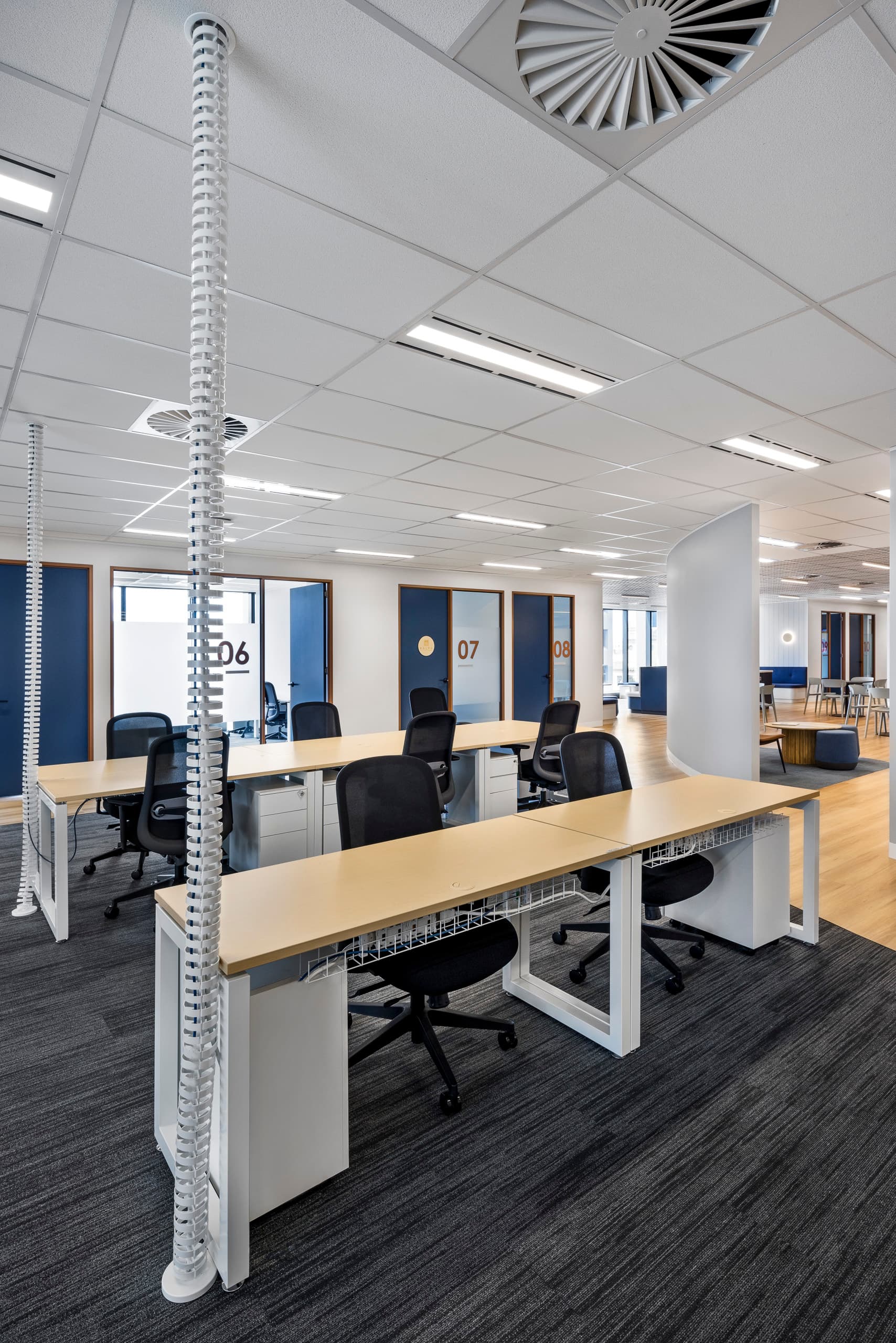 Shared desk spaces outside meeting rooms at 60 Moorabool Street, Geelong