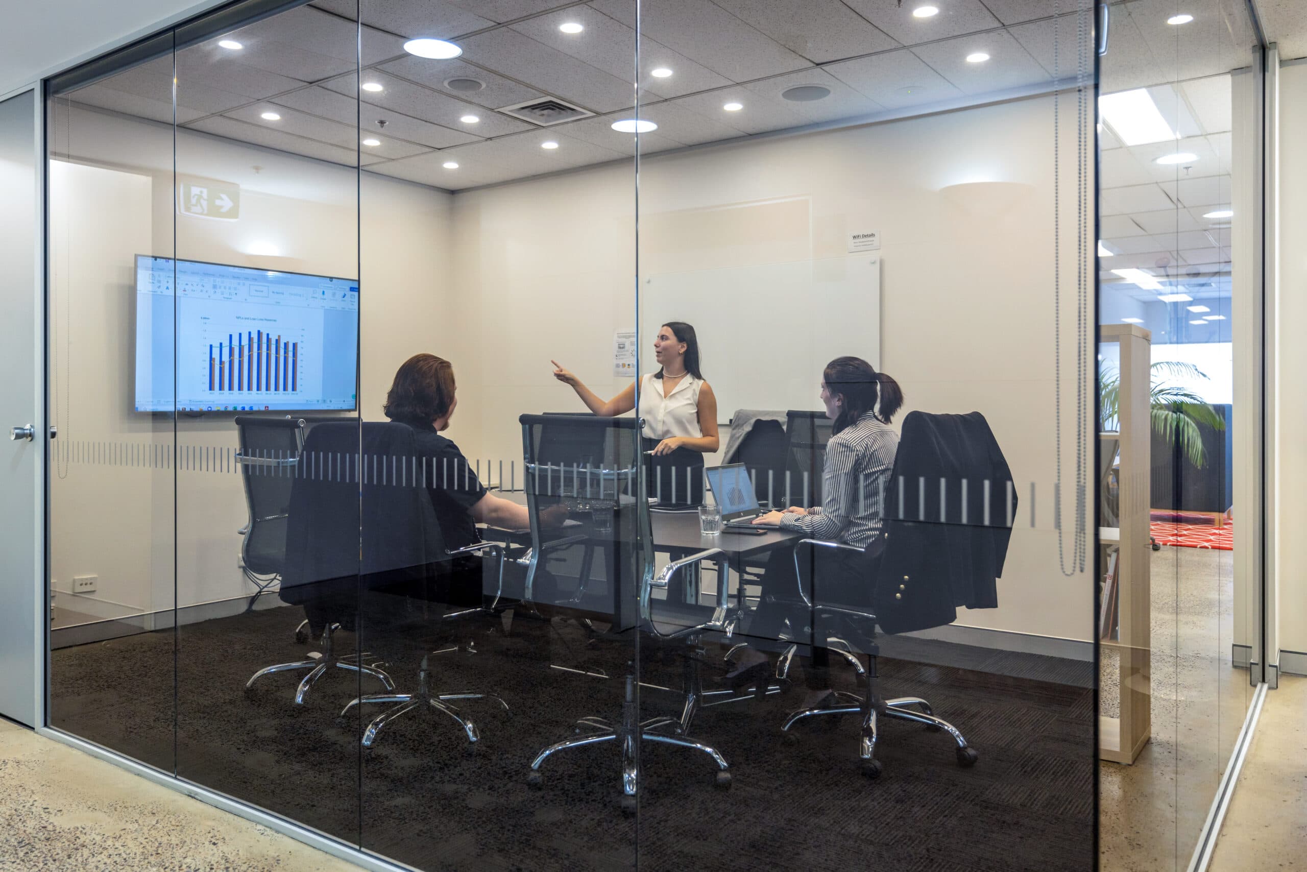 View into meeting room with transparant glass walls for 8 people at 60 Station Street, Parramatta