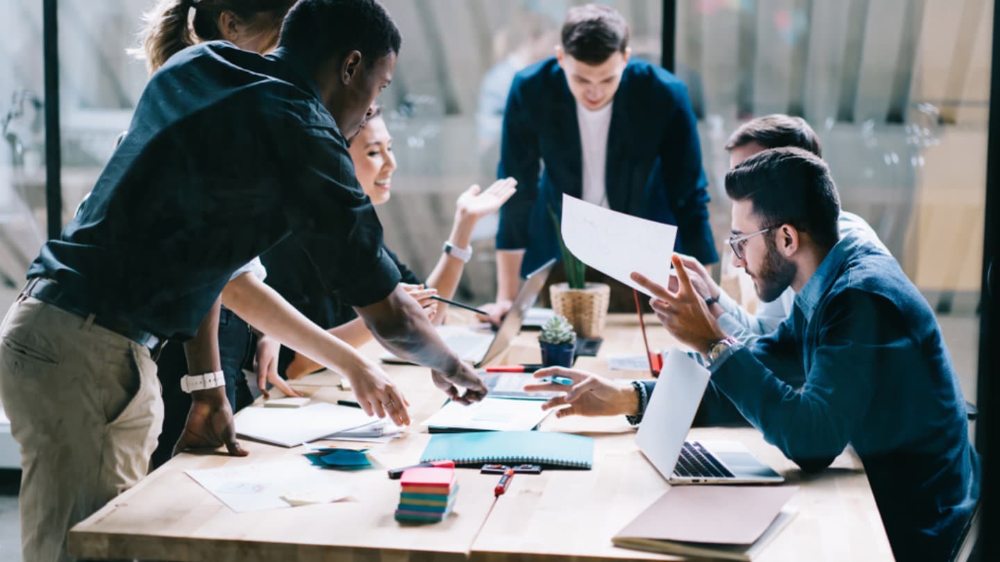 A group of colleagues engaged in a productive meeting at a Workspace365 location